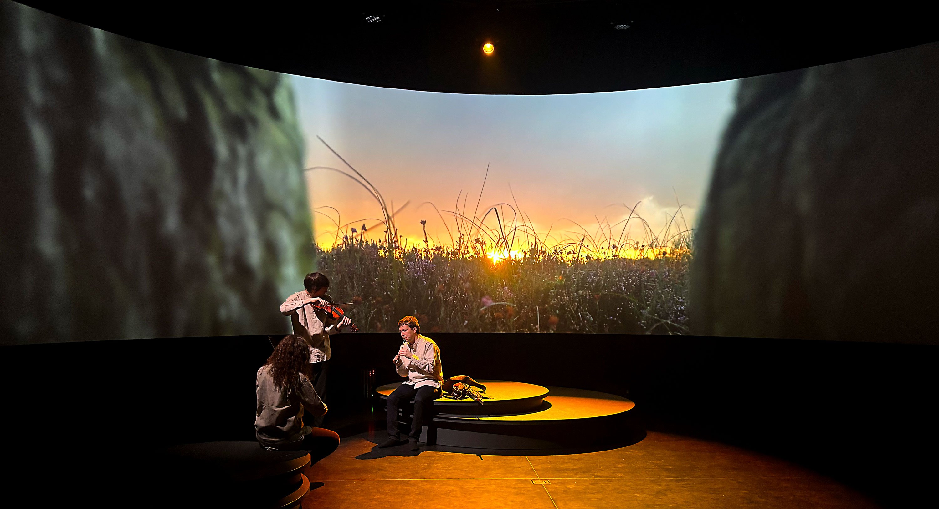 Three Irish traditional musicians playing their instruments