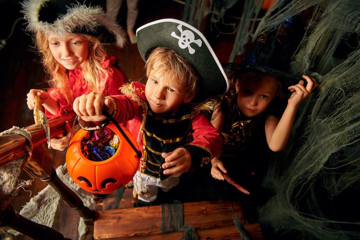 Children dressed up trick or treating.